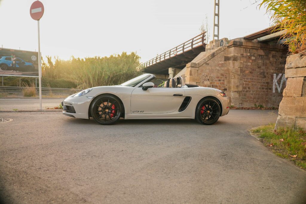 White Porsche 718 Boxster, bridges, murals, landscapes
